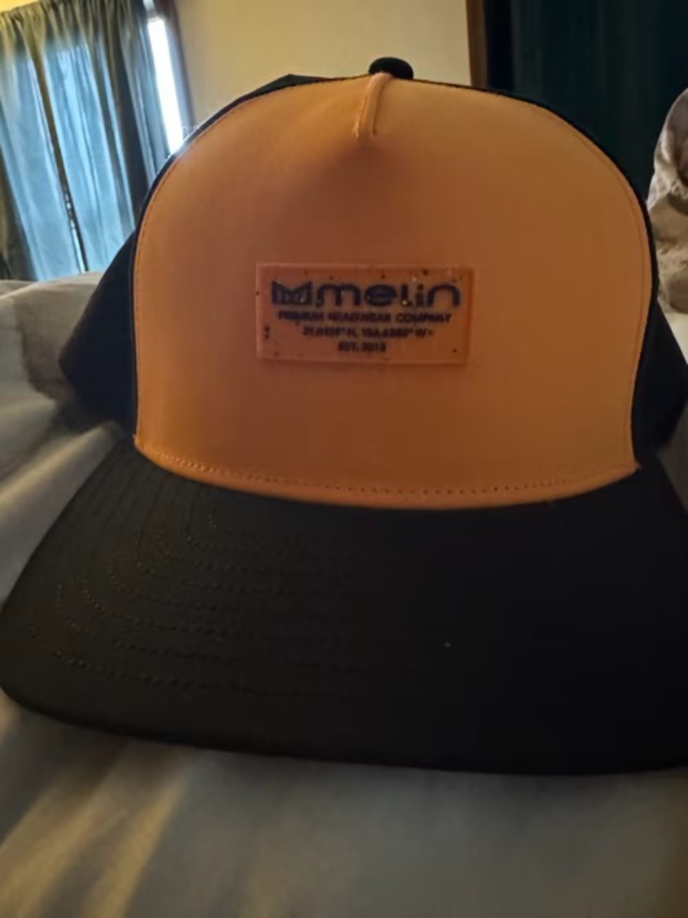Melin Orange and Black Foam Front Trucker Hat